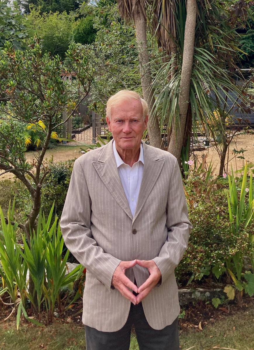 Elliot Hyland Elliot Hyland stands in front of palms and other plants